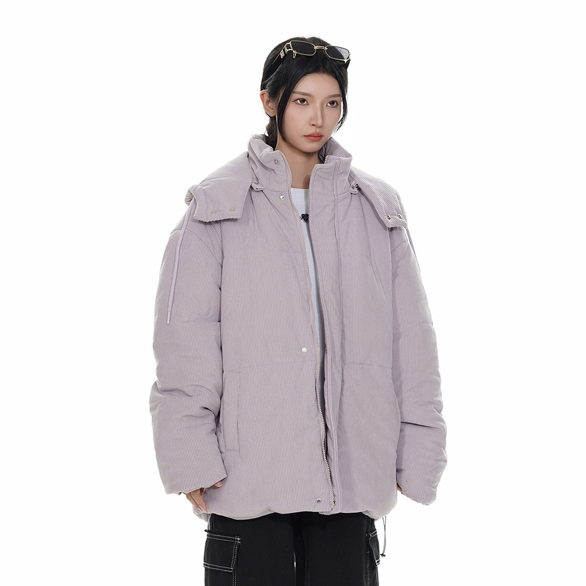 Model wearing a pale lavender padded jacket with a high collar, shoulder flaps, front zipper and snap closures.