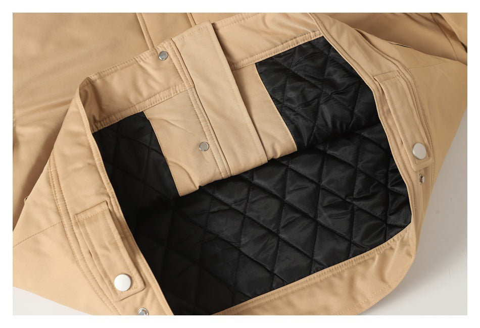 Tan jacket opened to show its black diamond-quilted lining and snap-front construction.