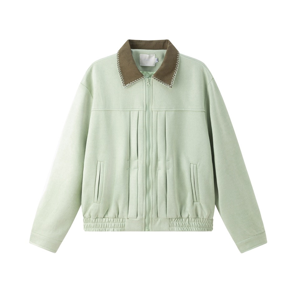 Mint green zip-front jacket with olive-brown ribbed collar, front pleats, slanted pockets and elastic hem, flat lay