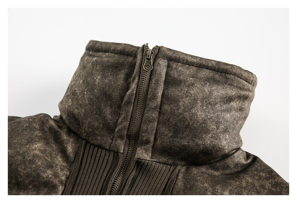 Close-up of the jacket's mottled brown high collar, front zipper and ribbed trim.