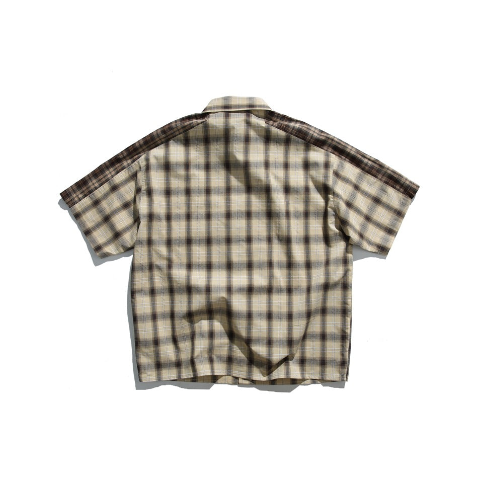Back view of khaki and brown plaid short-sleeve shirt with darker plaid shoulder panels
