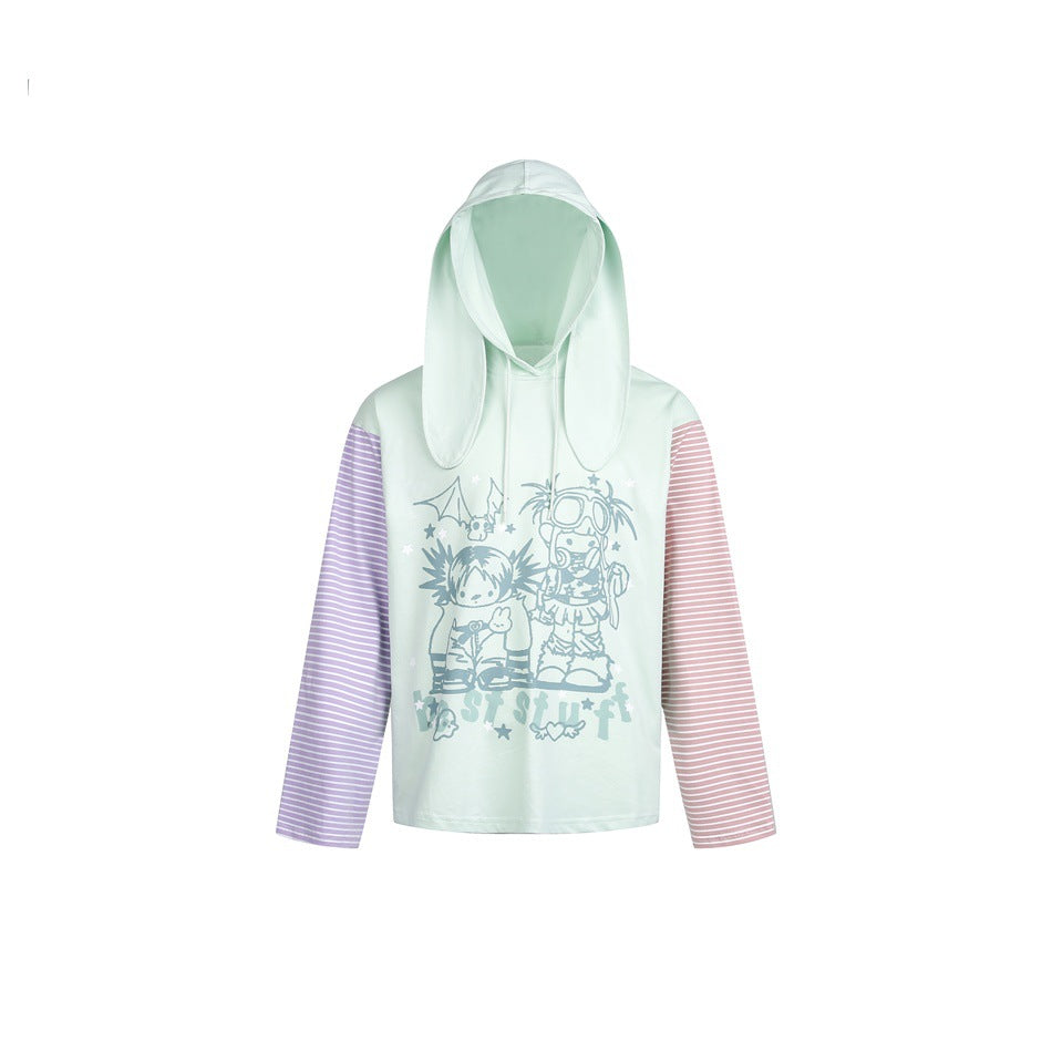 Mint green bunny-ear hoodie with purple and pink striped sleeves and a cartoon character print on the front