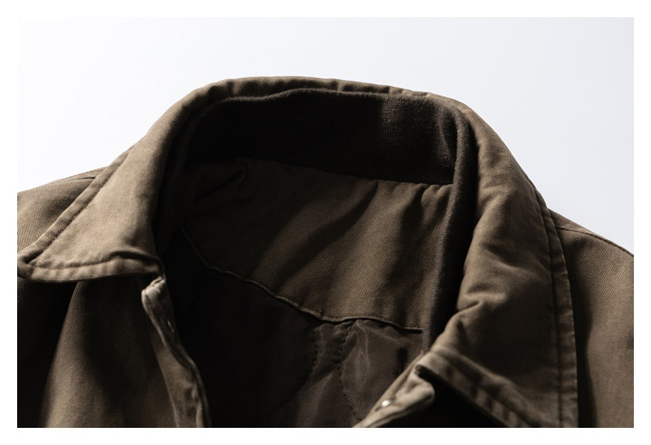 Close-up of the brown jacket’s collar and back neck, showing the dark inner lining.