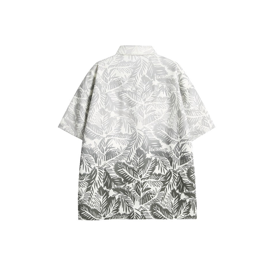 Back view of a white short-sleeve button-up shirt with an all-over gray tropical leaf print.