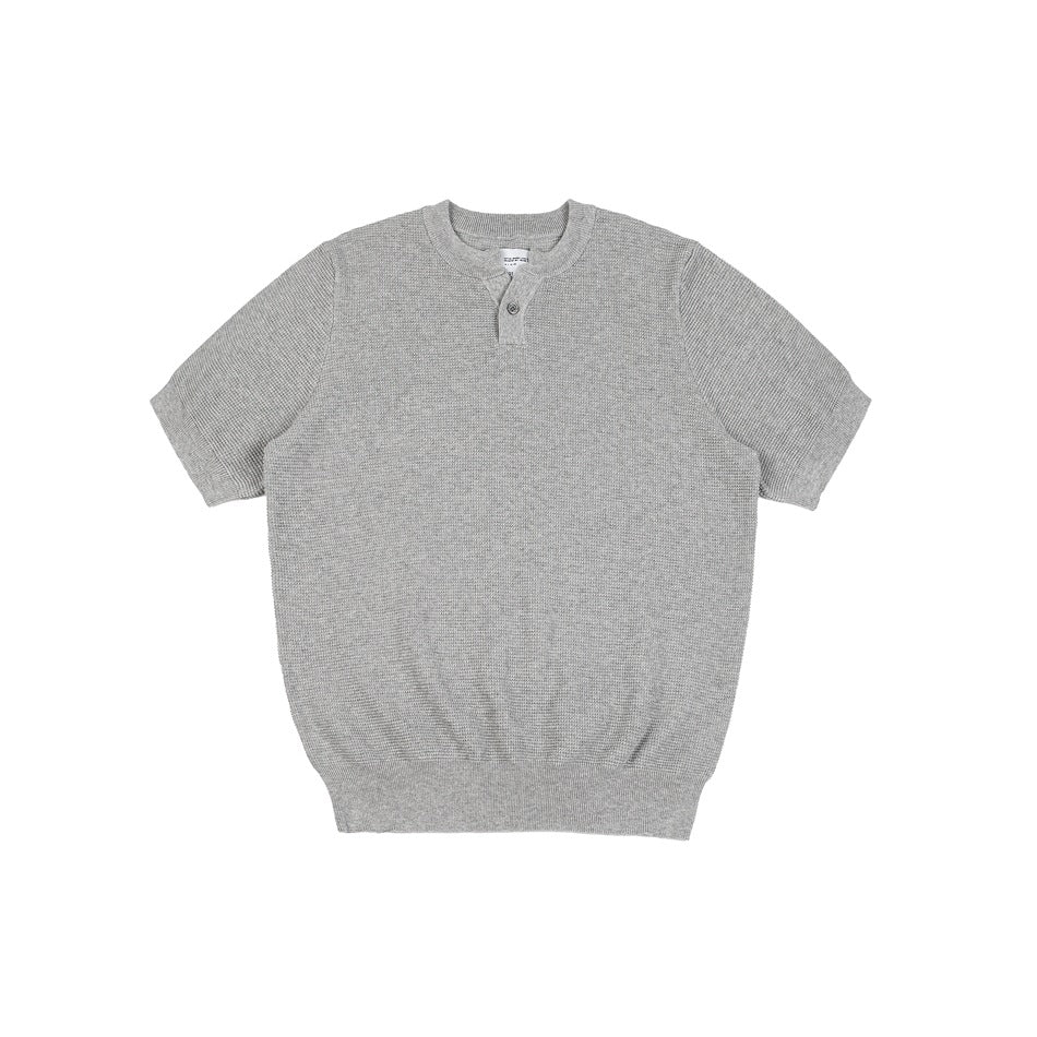 Gray short-sleeve knit top with textured waffle knit, round neck and button placket, flat front view