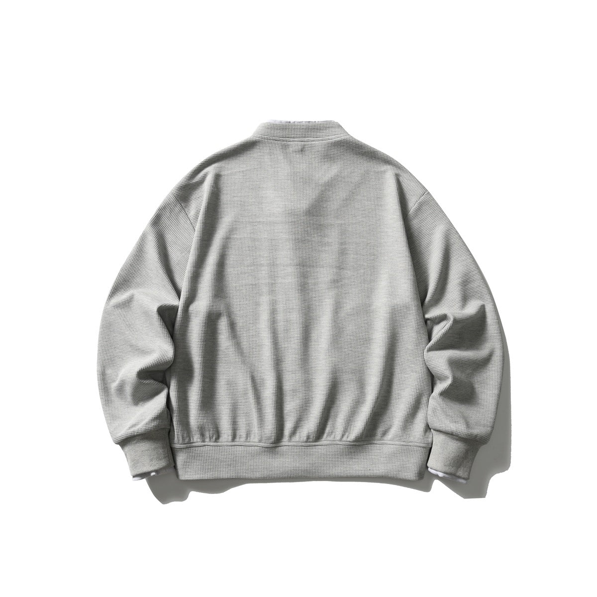 Back view of a light gray textured jacket with a stand collar, long sleeves, and ribbed cuffs and hem.