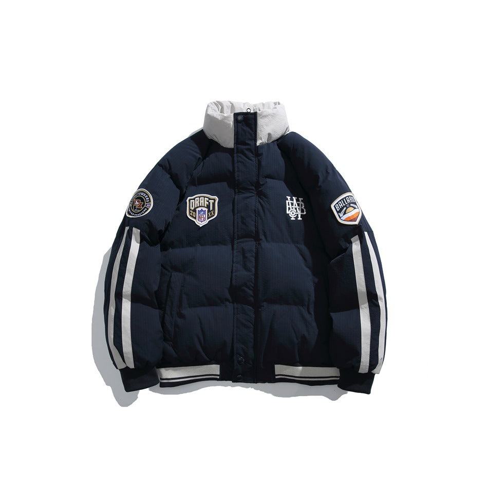 Navy puffer jacket with light gray stand collar, white sleeve stripes, chest patches and striped ribbed hem, front view