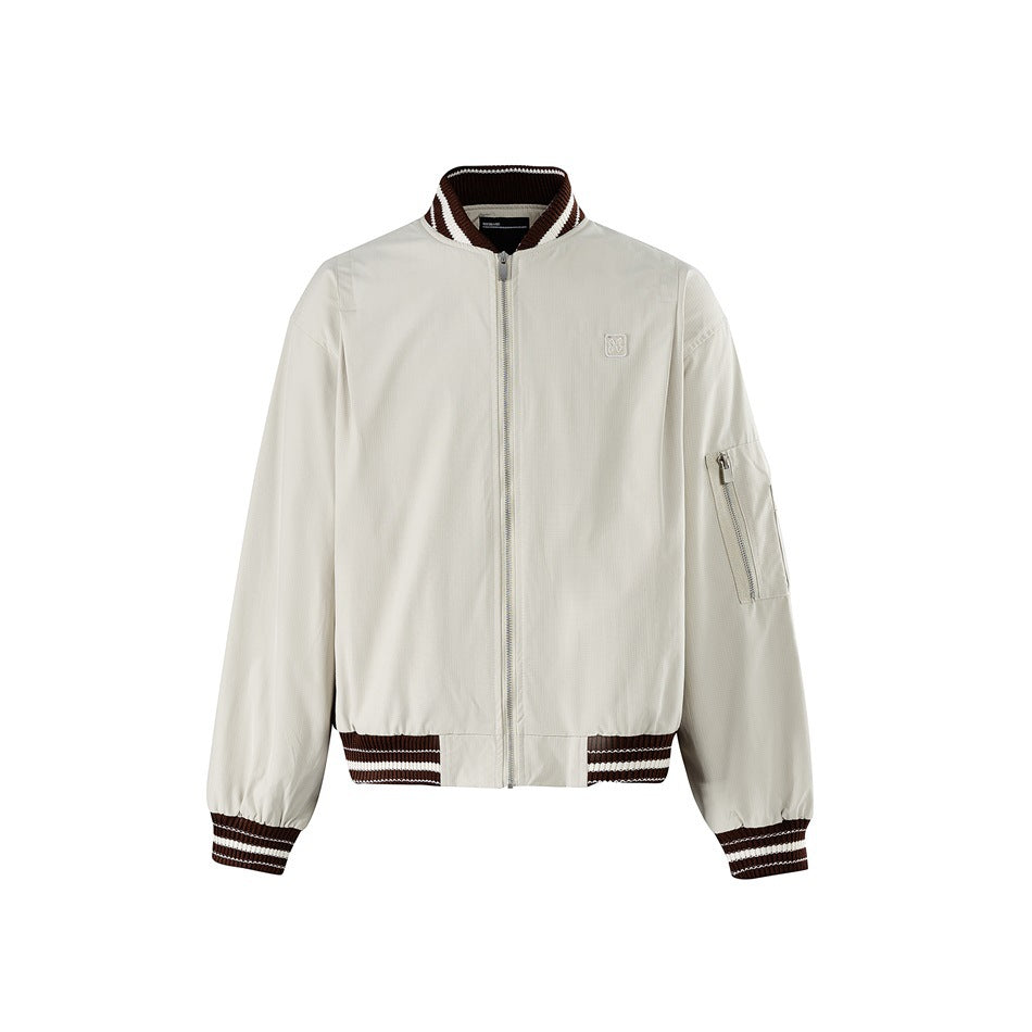 Off-white bomber jacket with brown and white striped ribbed collar, cuffs and hem, front zip and sleeve zip pocket