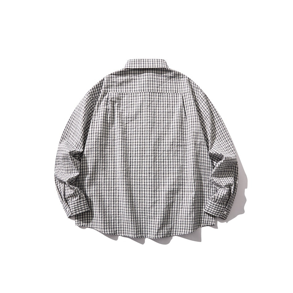 Back view of a laid-flat gray-and-black plaid long-sleeve button-up shirt.