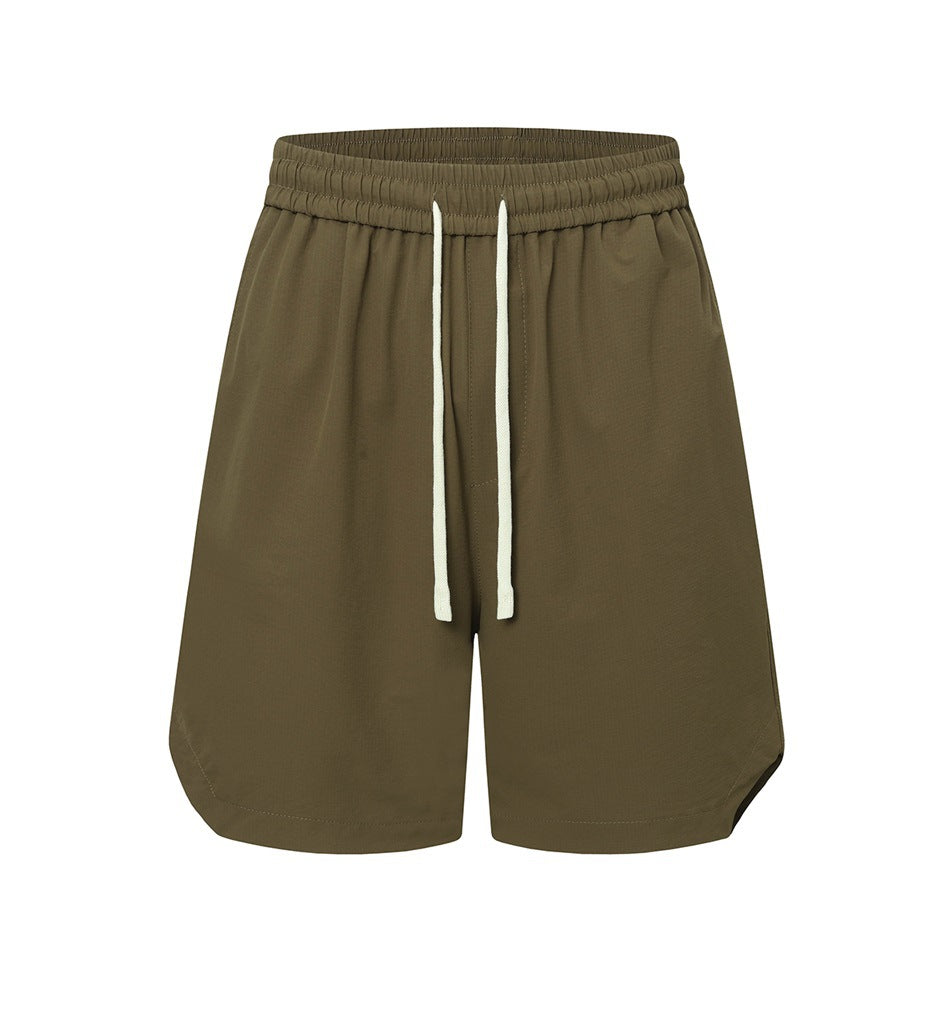 Olive green drawstring shorts with elastic waistband and curved side hems, front view on white background