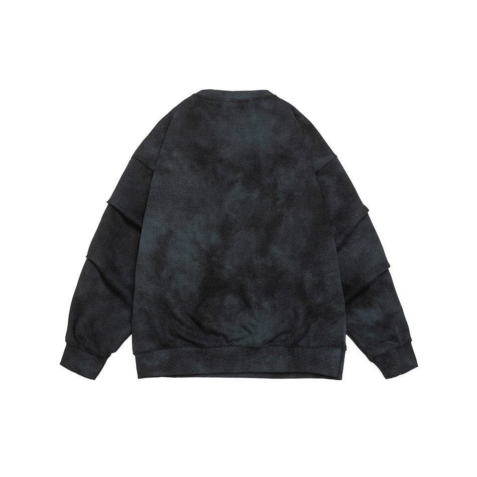 Back view of a dark charcoal mottled crewneck sweatshirt with long sleeves and ribbed cuffs and hem.