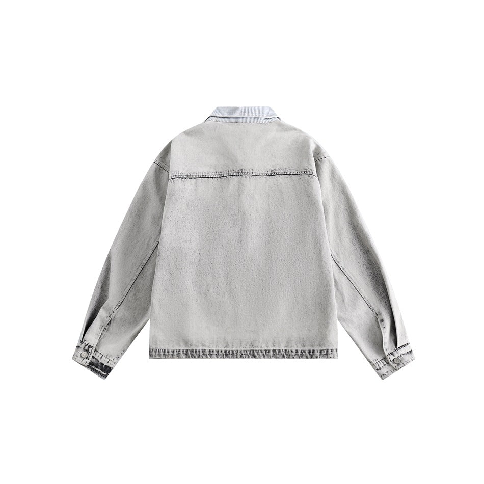Back view of a light gray acid-wash denim jacket with a ribbed collar, long sleeves, and a horizontal yoke seam.