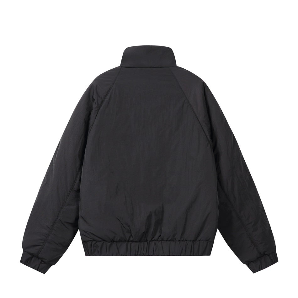 Back view of a black high-collar jacket with raglan sleeves and gathered cuffs and hem.