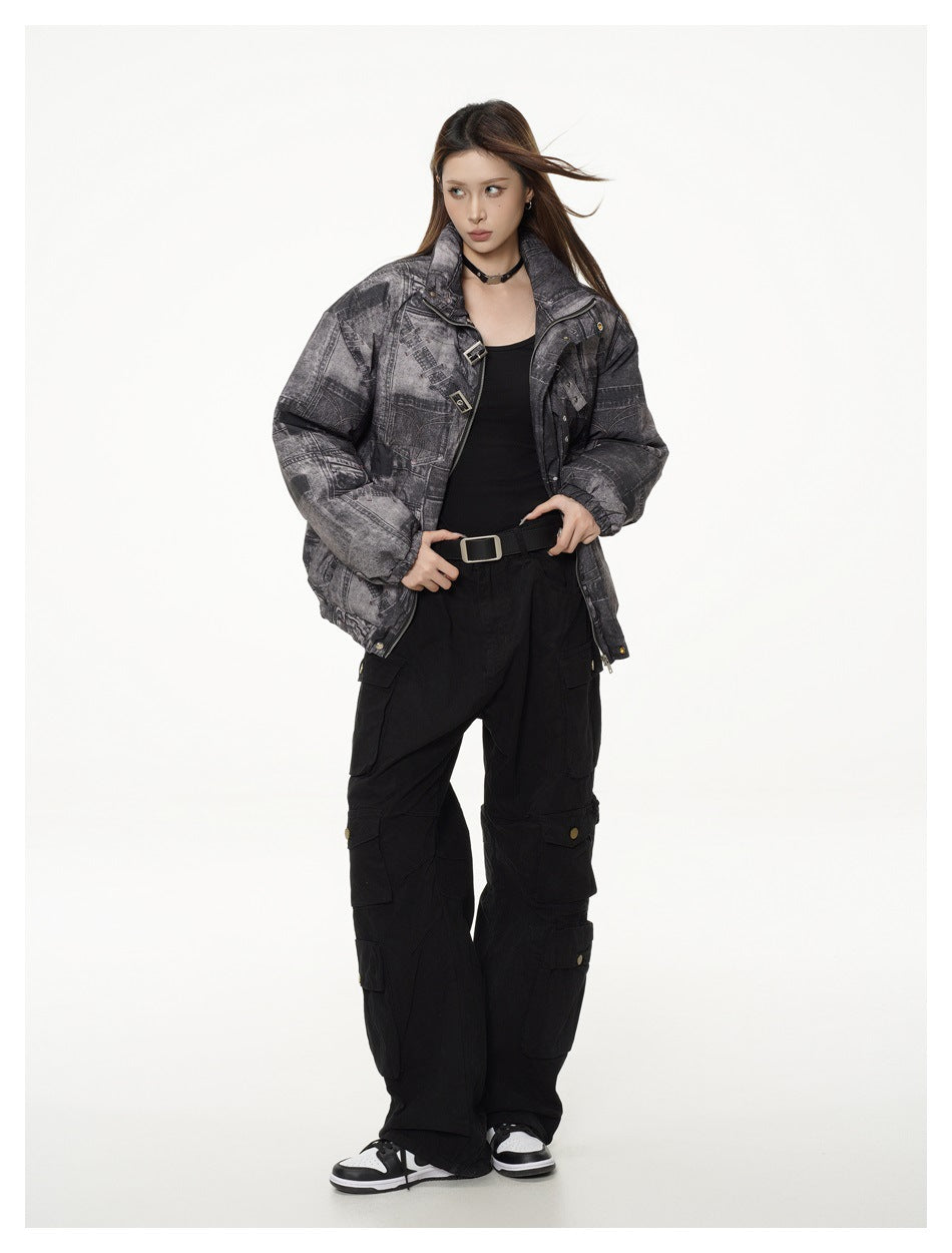 Full-length model wearing a charcoal patchwork-print padded jacket, black cargo pants and black-and-white sneakers.