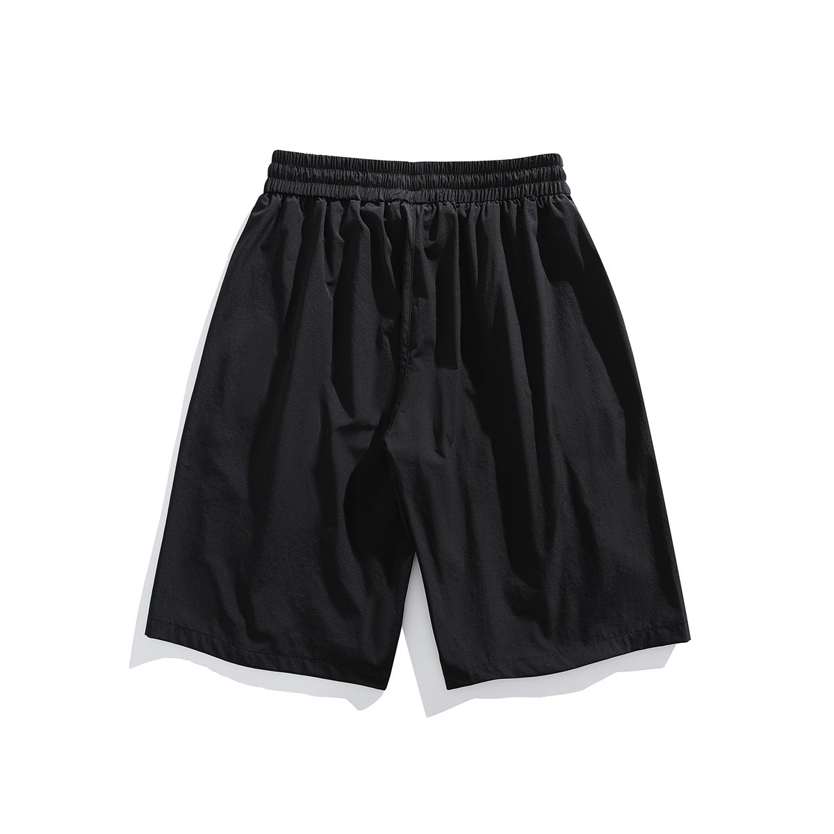 Back view of black loose-fit shorts with a gathered elastic waistband and plain legs.