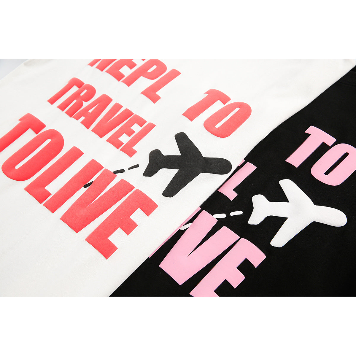Close-up of white and black T-shirt prints with bold lettering and airplane graphics.