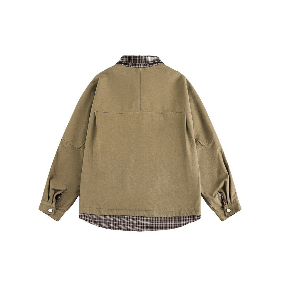 Back of a khaki overshirt with a brown plaid collar and hem, long sleeves, and buttoned cuffs.