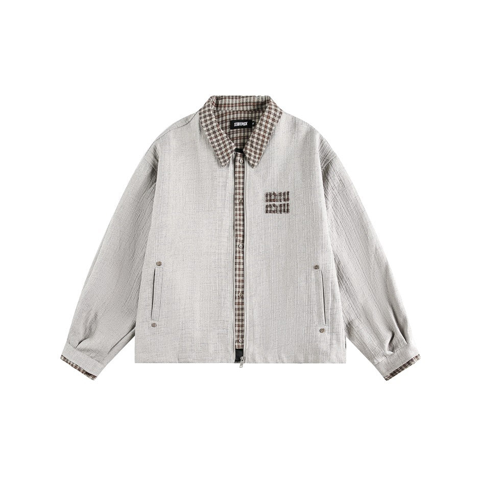 Beige textured zip jacket with brown plaid collar, placket and cuffs, flat front view