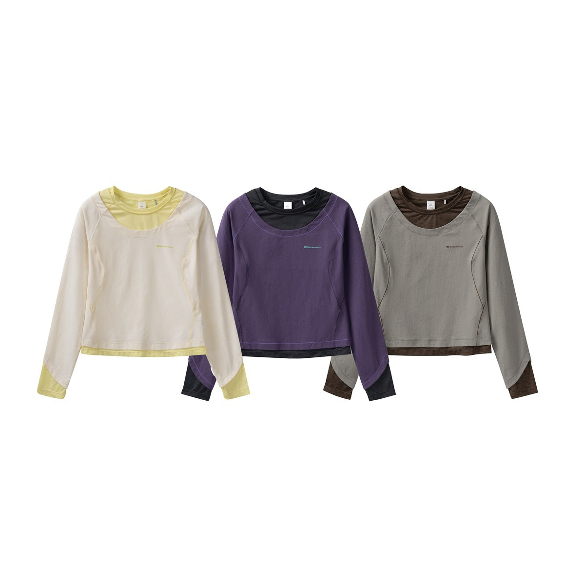 Three long-sleeve tops shown in cream with yellow trim, purple with black trim, and gray with brown trim.