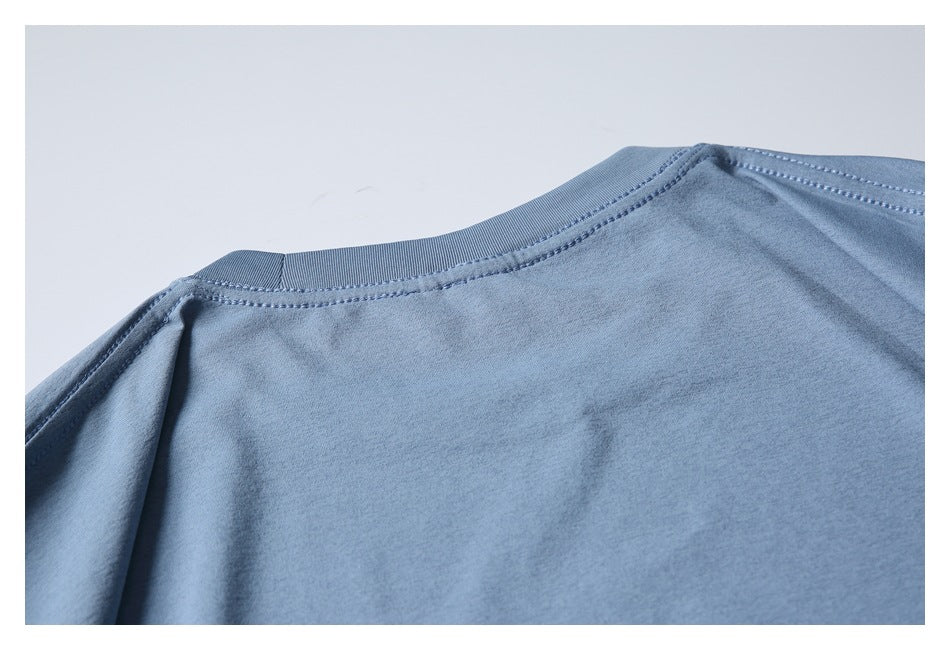 Close-up of the blue garment's back neckline and shoulder stitching.