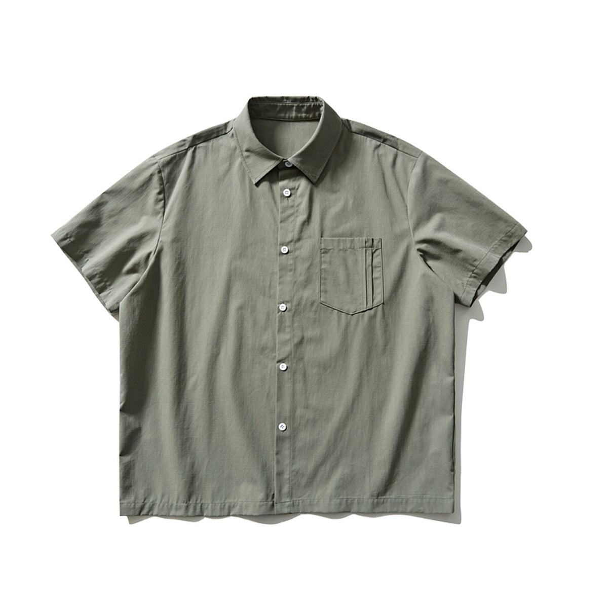 Green short-sleeve button-front shirt with chest pocket, flat lay front view