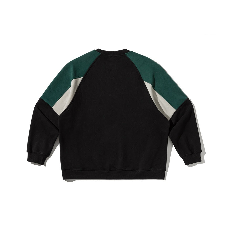 Back view of a black sweatshirt with dark green shoulder panels and light gray inserts.