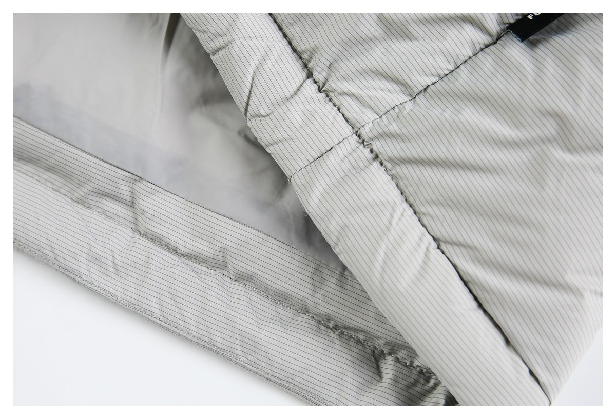 Close-up of the light gray pinstriped garment's interior, showing its lining and stitched seams.