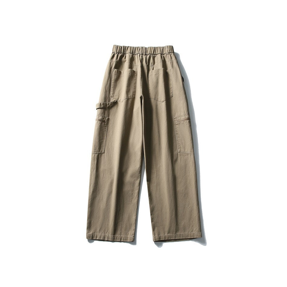 Back view of taupe wide-leg cargo trousers with an elastic waistband, two rear pockets, and side cargo pockets.