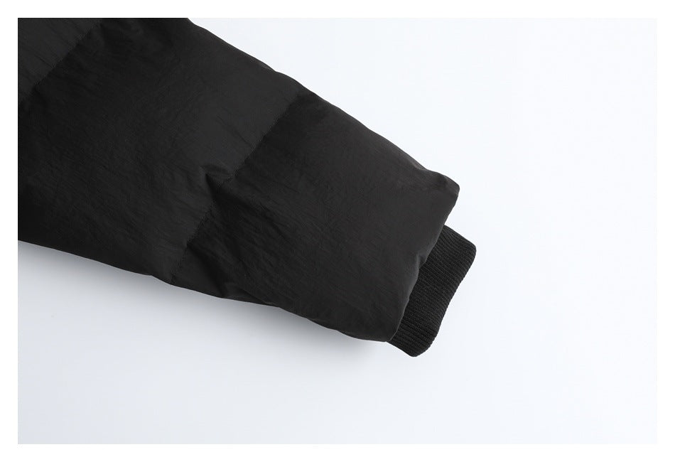 Close-up of the black jacket sleeve and ribbed cuff.