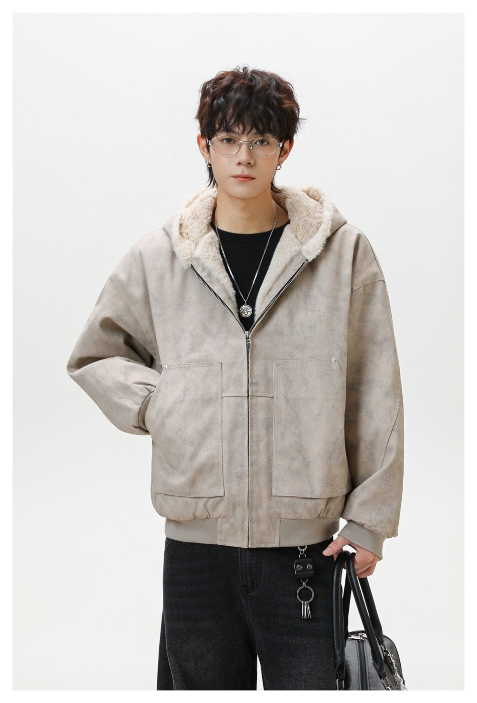 Front view of a model wearing a taupe hooded jacket with cream plush lining and two large pockets.