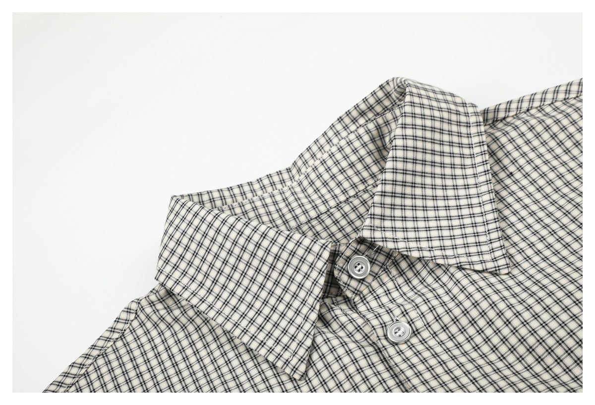 Close-up of the shirt's checked pointed collar and upper buttons.