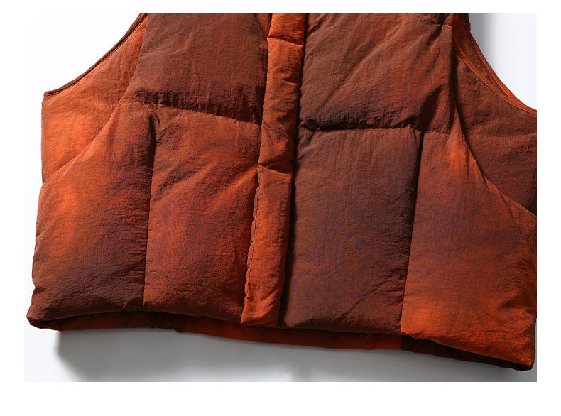 Close-up of the rust-orange padded garment's lower front panels and center placket.