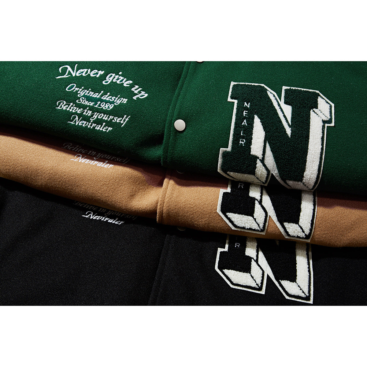 Overlapping green, tan, and black varsity jackets show large letter patches and decorative embroidery.