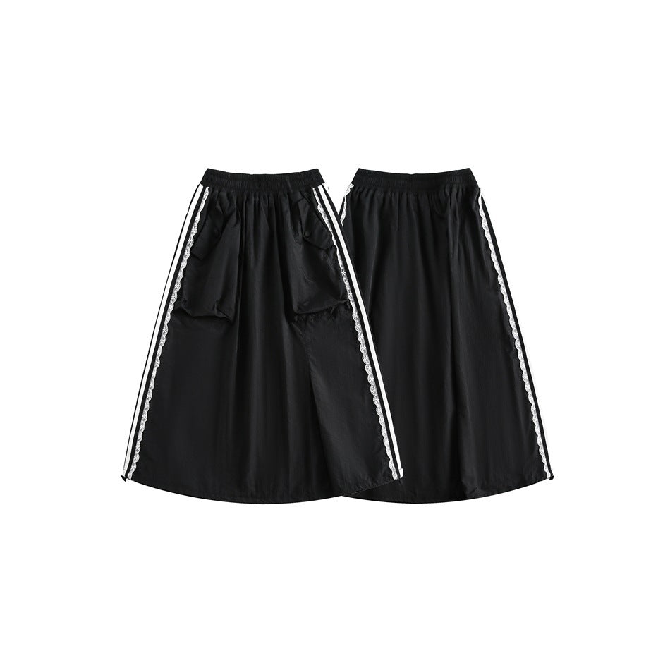 Front and back views of a long black skirt with an elastic waist, front pockets, and white striped lace side trim.