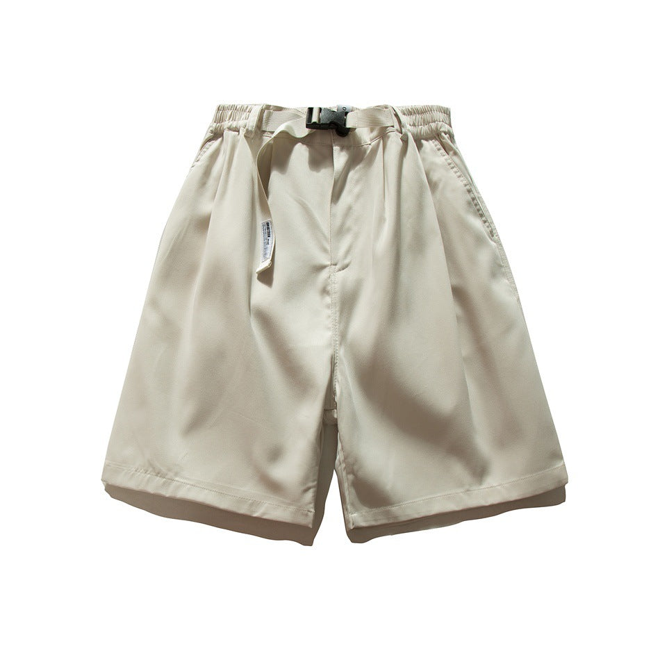 Beige knee-length wide-leg shorts flat lay with elastic waist, buckle belt, front pleats and side pockets