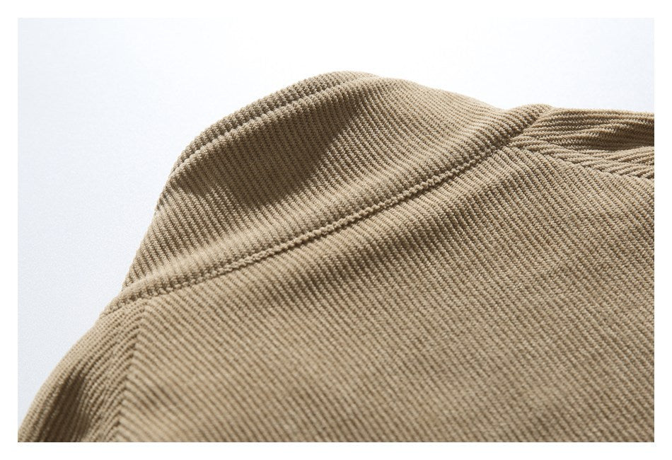 Close-up of the shoulder seam and ribbed texture on a tan jacket.