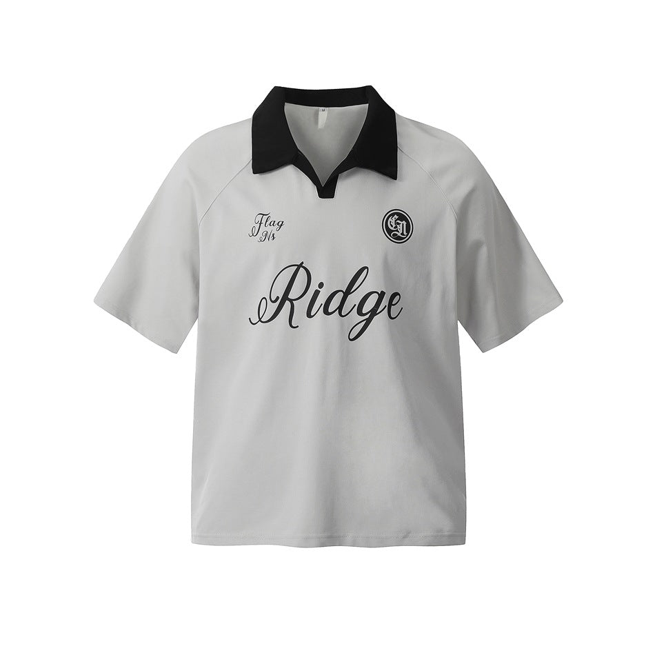 Light gray short-sleeve polo top with black open collar and black script Ridge print on the chest