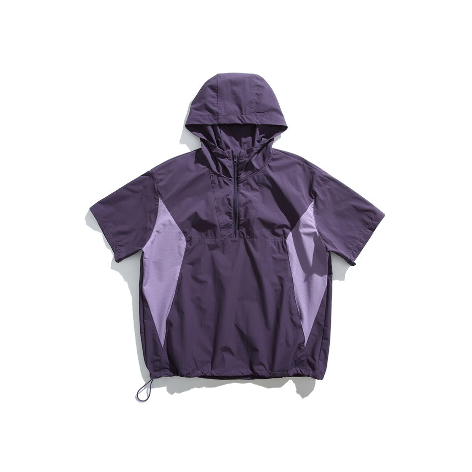 Purple short-sleeve hooded half-zip top with lavender side panels and drawcord hem, flat lay on white