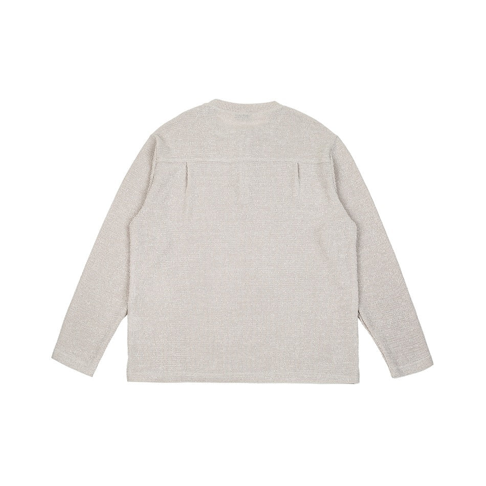 Back view of light gray knit long-sleeve top with yoke seam and center pleat