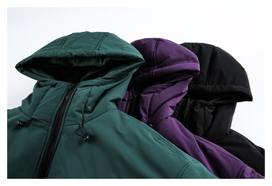 Close-up of three hooded jackets in dark teal, plum, and black, showing the hoods, drawcords, and zippers.