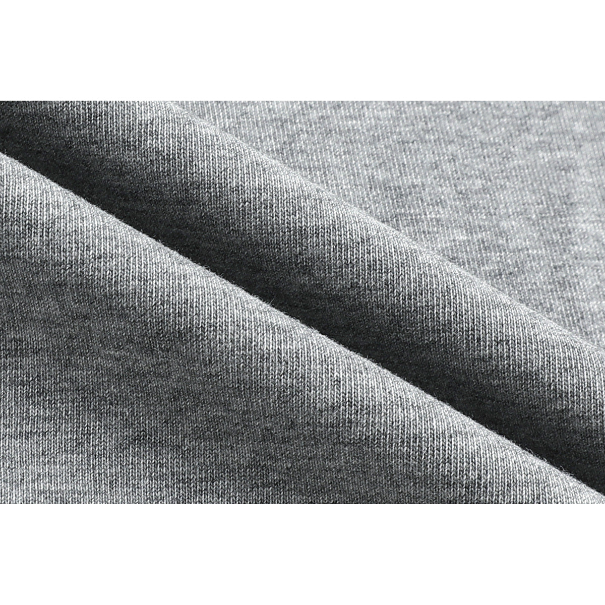 Macro view of the gray knit fabric, showing its texture and folds.
