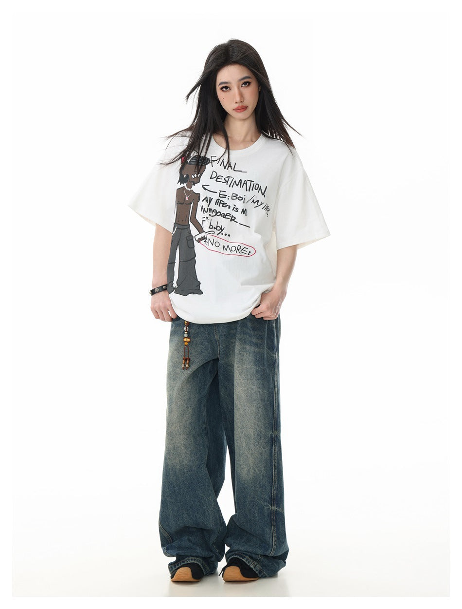Model wearing the white graphic t-shirt untucked over wide-leg faded blue jeans, hands near pockets
