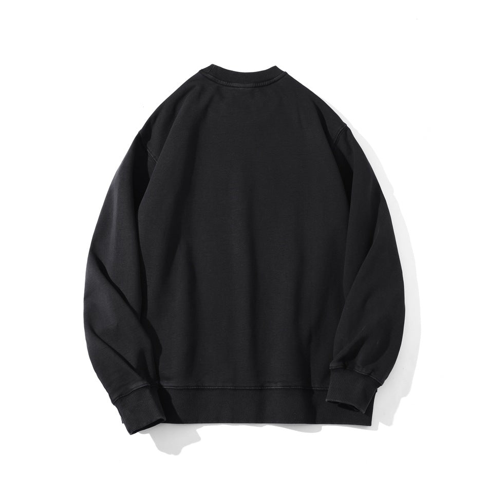 Plain black crewneck sweatshirt shown flat from the back, with long sleeves and ribbed cuffs and hem.