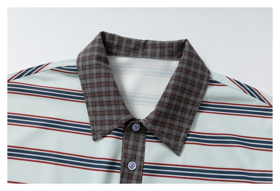Close-up of the polo's brown plaid collar and button placket against its pale mint striped body.