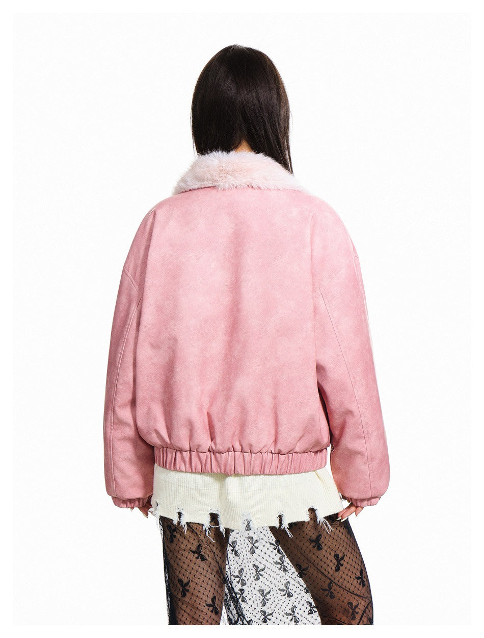 Back view of a model wearing a pink jacket with a pale fur collar and gathered hem.