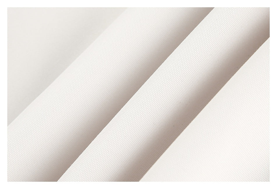 Close-up of white fabric showing a fine, tightly woven surface.