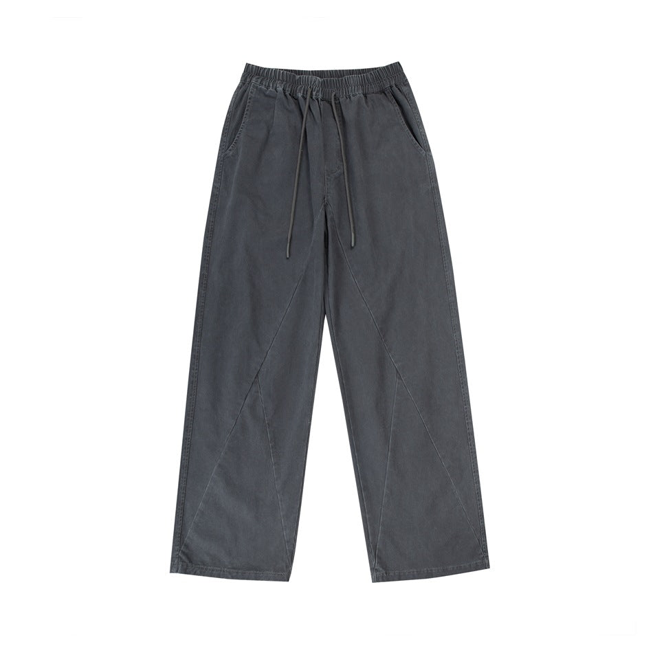 Gray wide-leg drawstring pants with elastic waist and diagonal leg seams, flat lay front view