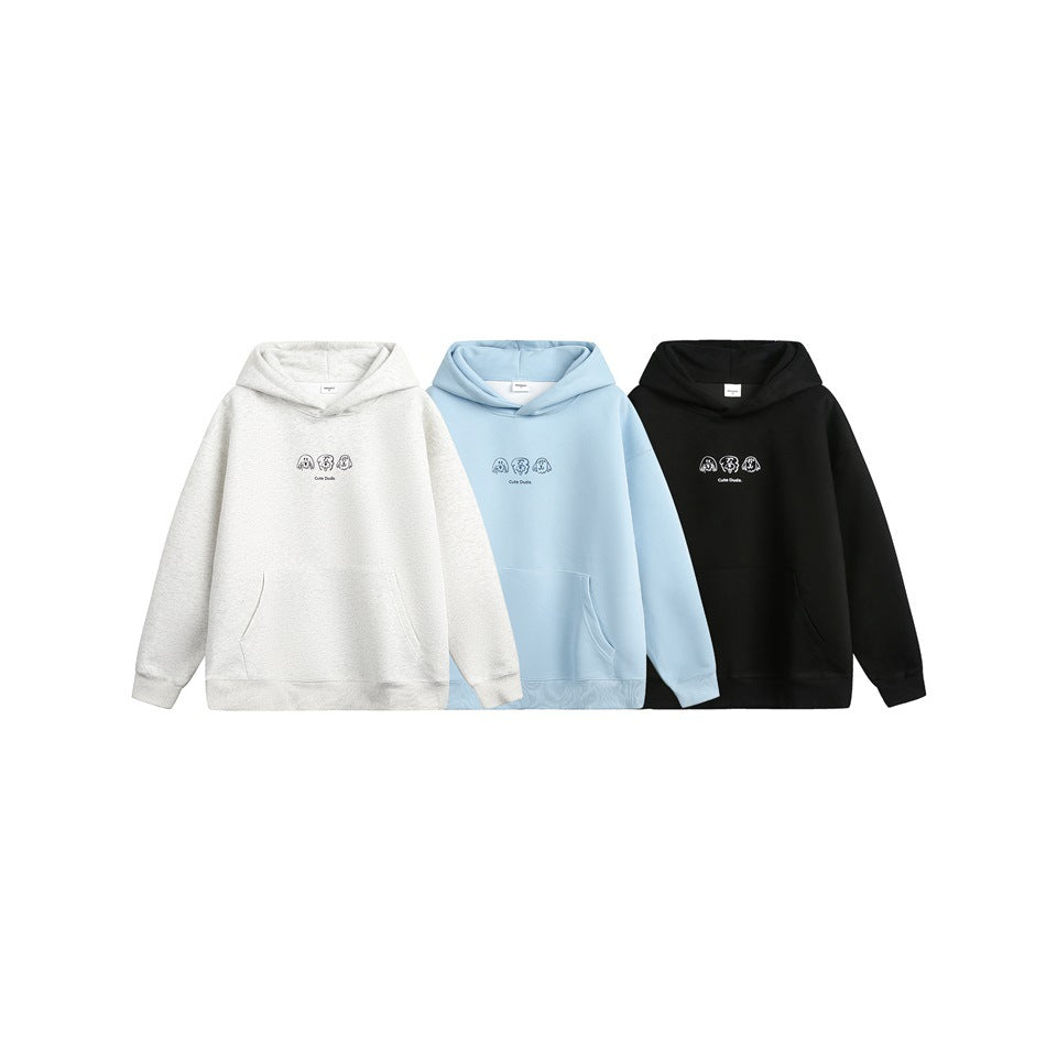 Front view of three pullover hoodies with small chest graphics, shown in light heather gray, pale blue, and black.