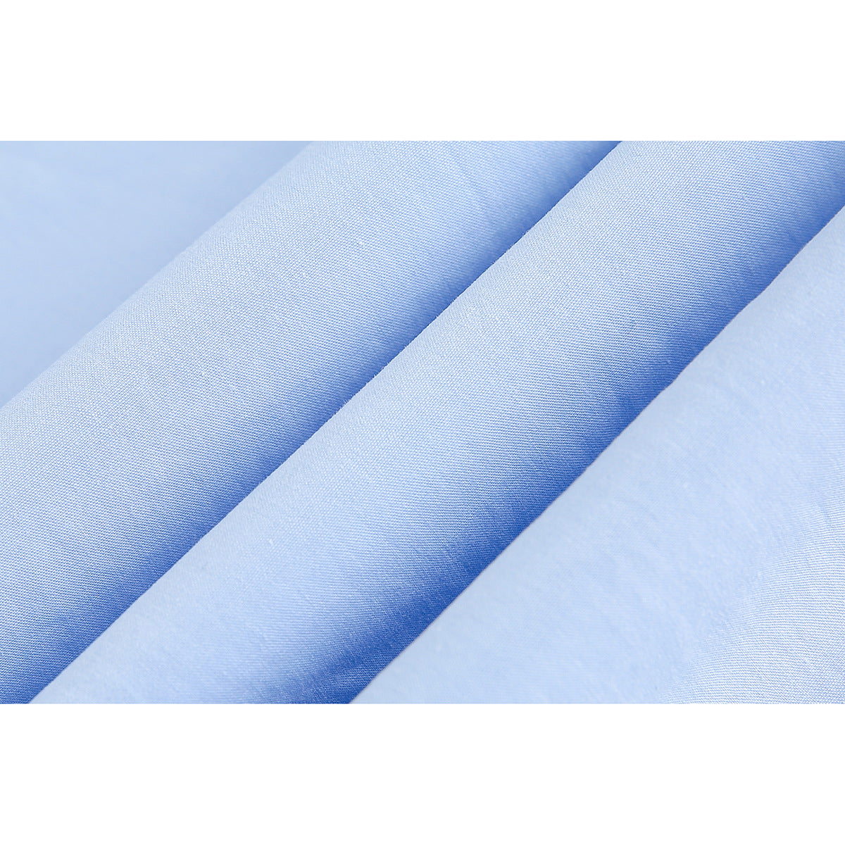 Macro view of smooth light blue fabric in several folds.