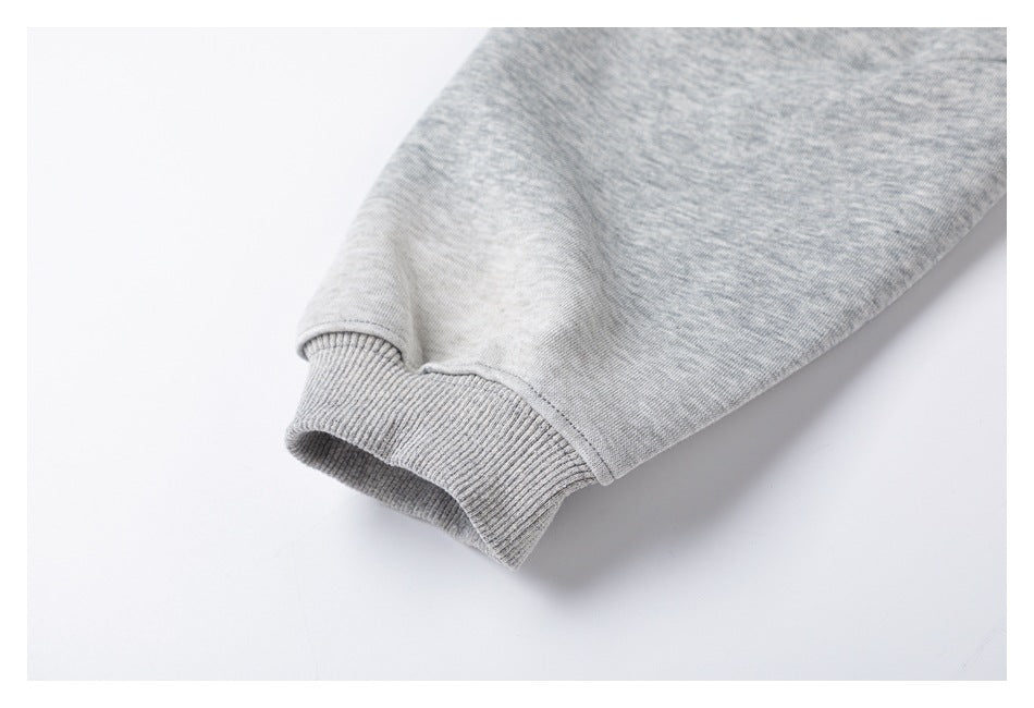 Close-up of a ribbed cuff on a heather-gray sleeve.